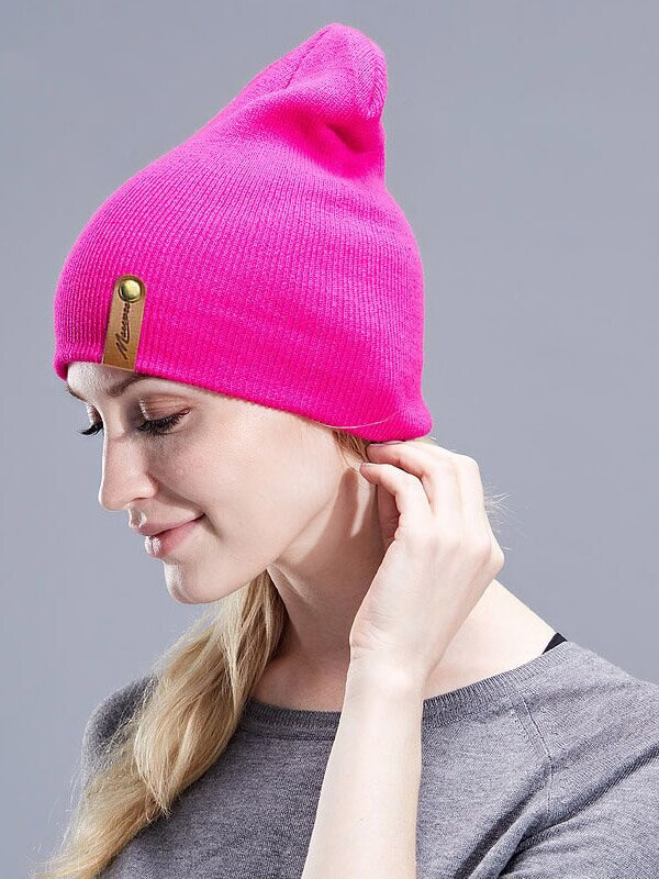 Unisex casual solid color knitted beanie in vibrant pink, thick warm hat perfect for winter, made from soft cotton material.